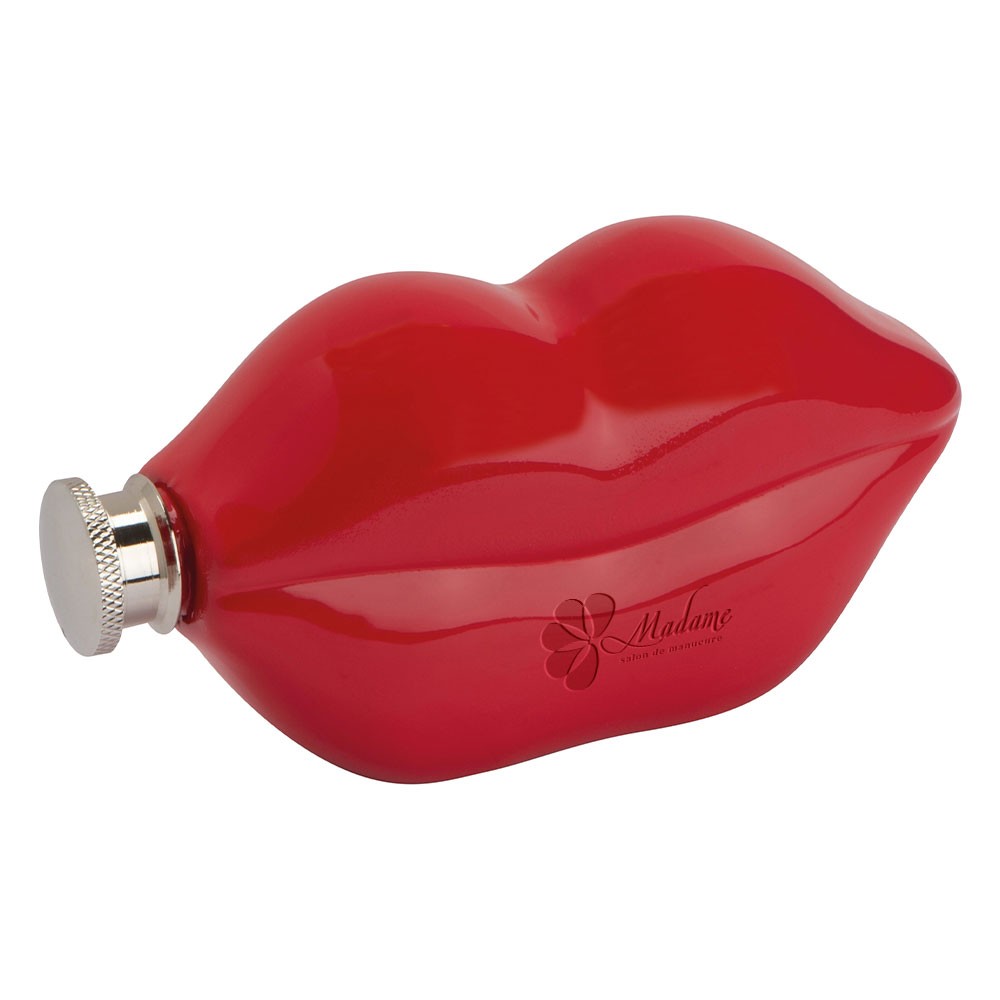 A hip flask shaped like lips with an engraved design, from West Deeping - Mapledurham