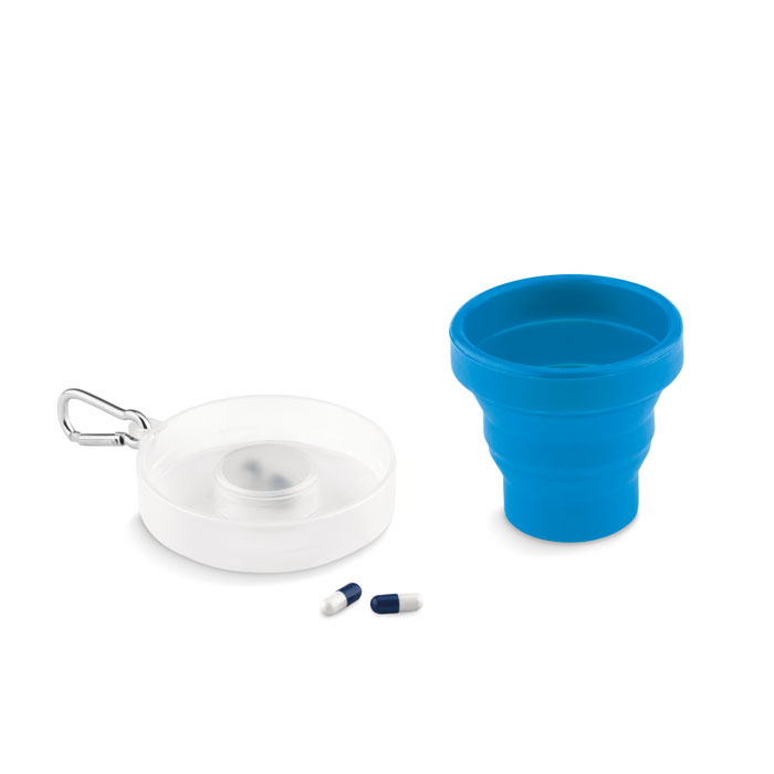 A cup made of silicone that can be folded for convenience. It also features a compartment for storing pills and a carabiner for easy attachment to bags or belts. - Emsworth