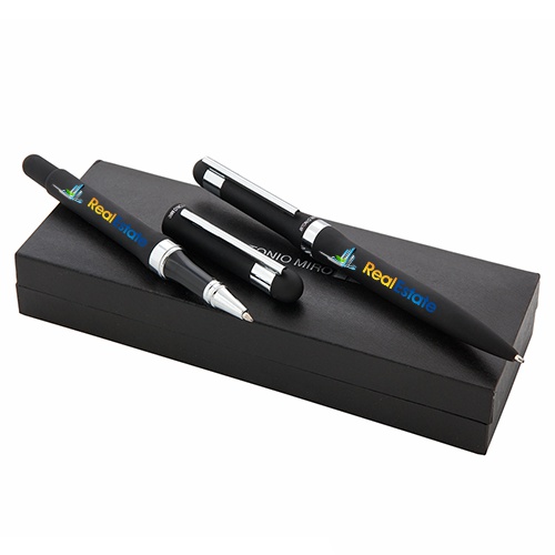 This is an elegant set by Antonio Miró that includes a twist mechanism ball pen and a hooded roller pen. - Forde Abbey
