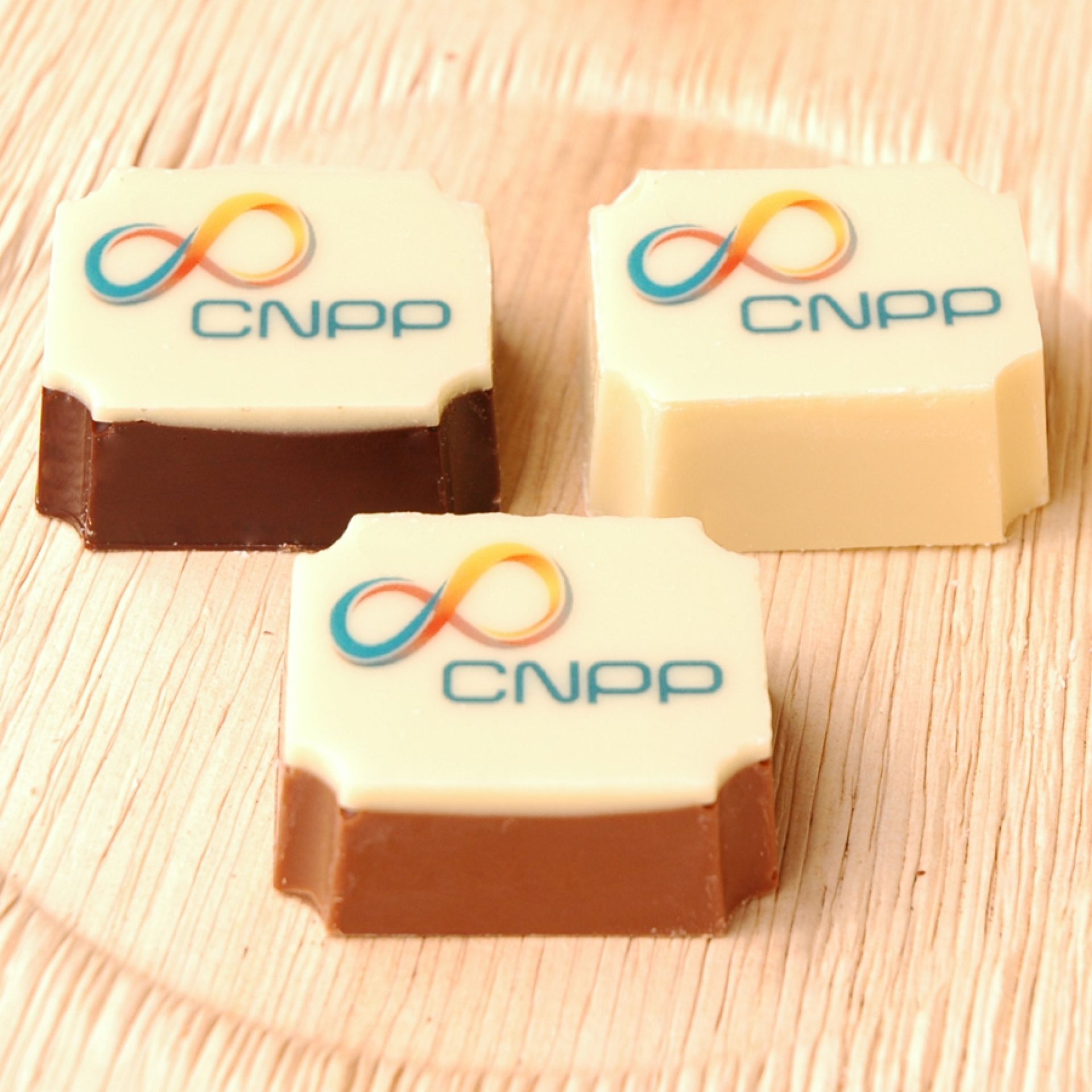 These are candies from Belgium that feature the Pluckley logo. - New Brighton