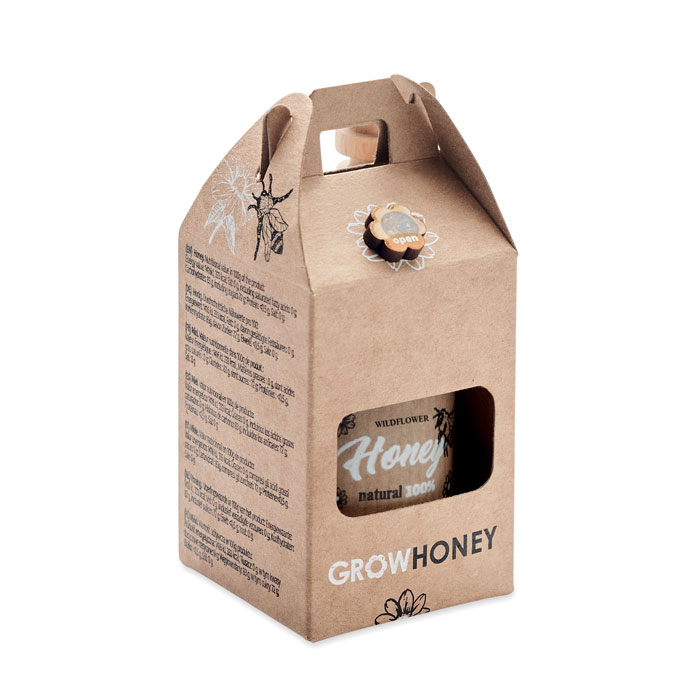 A jar of wildflower honey that comes with a wooden dipper and seeds for bee-pollinated flowers - Cwmbran