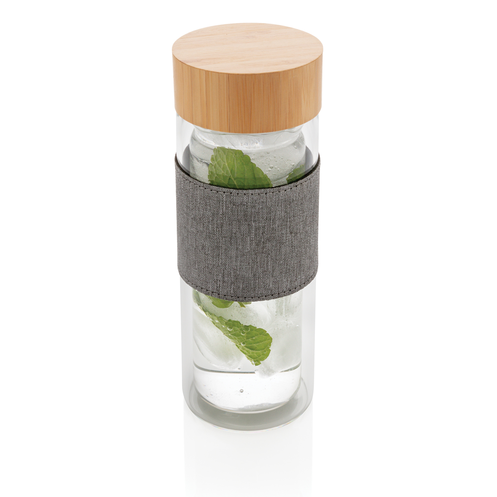 Impact resistant glass bottle featuring double walls for insulation, complete with a bamboo lid. - Ditchling