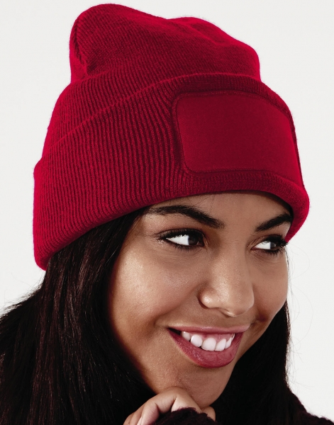 A double-layered knitted polyacrylic hat featuring a cotton twill patch - Church Broughton